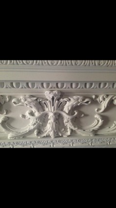 An English handcarved wooden fireplace surround in Georgian Style circa 1920