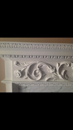 An English handcarved wooden fireplace surround in Georgian Style circa 1920