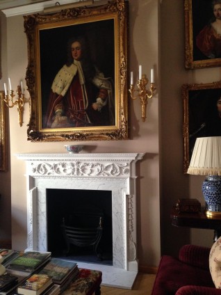 An English handcarved wooden fireplace surround in Georgian Style circa 1920